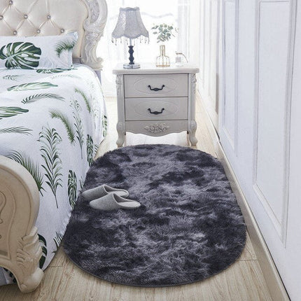 Oval mörkgrå mjuk shaggy sängmatta