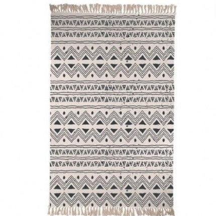 Beige ullmatta med svart trekantsmönster
