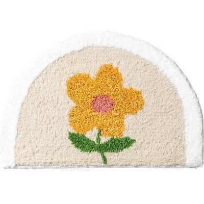 Halvrund gul badrumsmatta med blomma