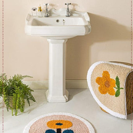 Halvrund gul badrumsmatta med blomma
