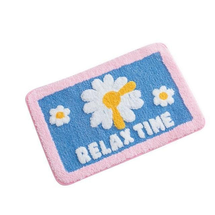 Blå badrumsmatta med blommigt relaxmotiv