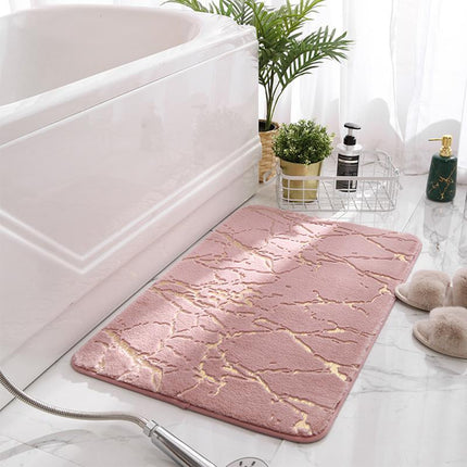 Ljusrosa badrumsmatta med elegant marmormönster