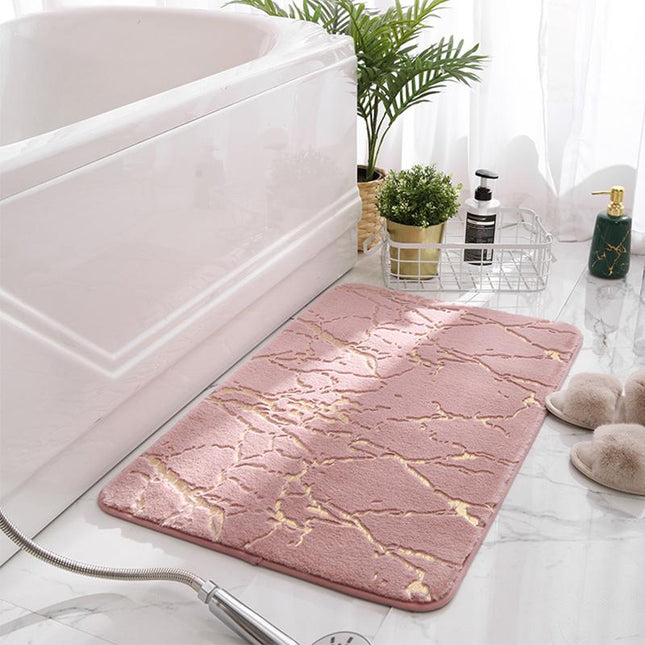 Ljusrosa badrumsmatta med elegant marmormönster
