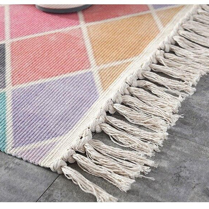 Rosa rutmönstrad matta med fransar