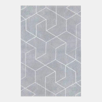 Grå shaggymatta med geometriskt mönster